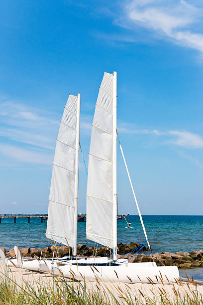 istock Two Catamaran Sailboats at the Beach 507682661