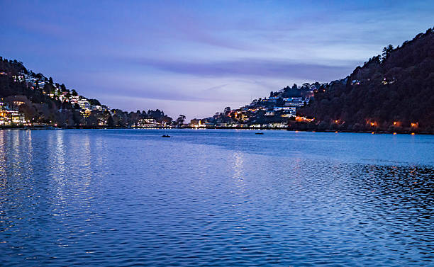 istock Blue lake with reflection of lights 507682900