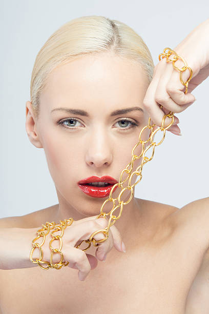 istock Young beautiful woman with neck chain 507683445