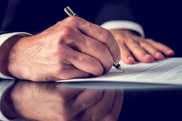 istock Signing mortgage papers 507683731