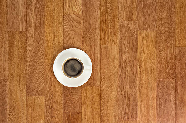 istock White cup of coffee on wooden table. 507684645