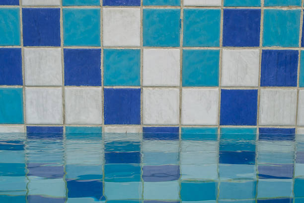 istock Blue ceramic tile mosaic in swimming pool 507684658