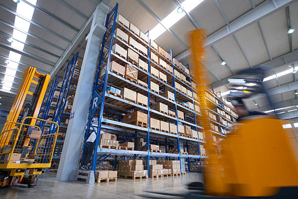istock Forklift carrying cardboard box in warehouse. 507684930