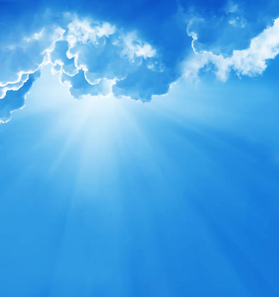 istock blue sky with sun and beautiful clouds 507685171