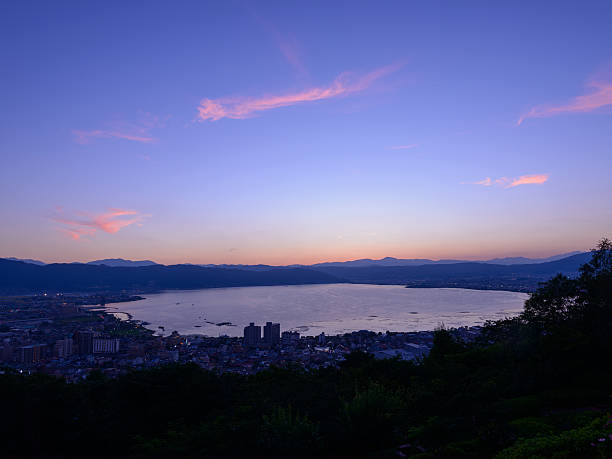 Night view of the city of Suwa Night view of the city of Suwa. The Suwa region is the leading industrial area of Nagano and was once known as "The Oriental Switzerland" for its highly developed precision machinery industry. suwa lake photos stock pictures, royalty-free photos & images