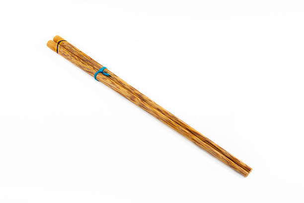 istock wooden chopsticks on white background. 507685840