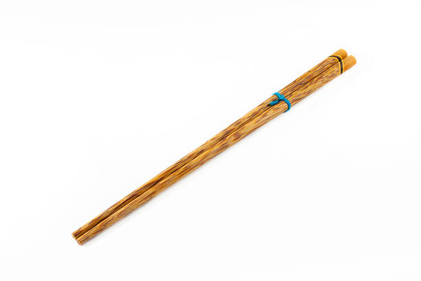 istock wooden chopsticks on white background. 507685942