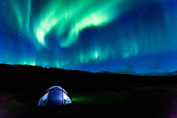 istock Illuminated tent and aurora in Iceland 507686068