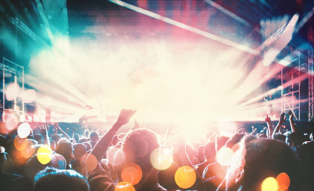 istock People at concert party. 507686504
