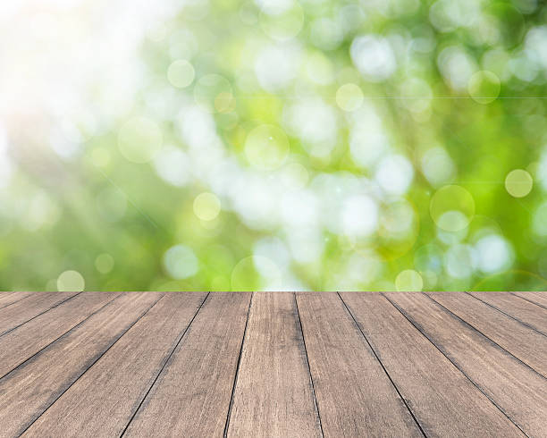 istock Wood table top on blurred green background 507687014