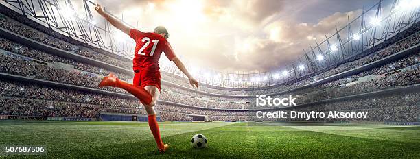 Soccer Player Kicking Ball In Stadium Stock Photo - Download Image Now - Soccer, Soccer Ball, Stadium