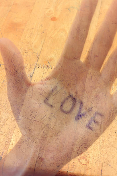 istock Motion blur text love on hand and wood background. 507687764
