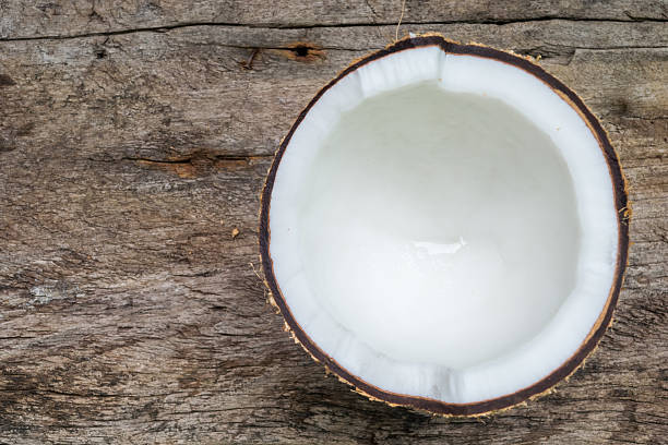 istock Coconut isolated on wood background 507687928