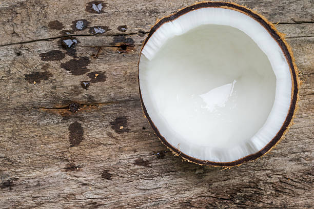 istock Coconut isolated on old wood background 507688100