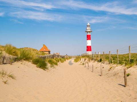 Lighthouse on the coast of the North Sea in a sunny day, Belgium