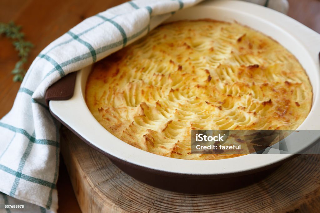 homade Shepherd's Pie in casserole dish homade Shepherd's Pie in the casserole dish. Brown Stock Photo