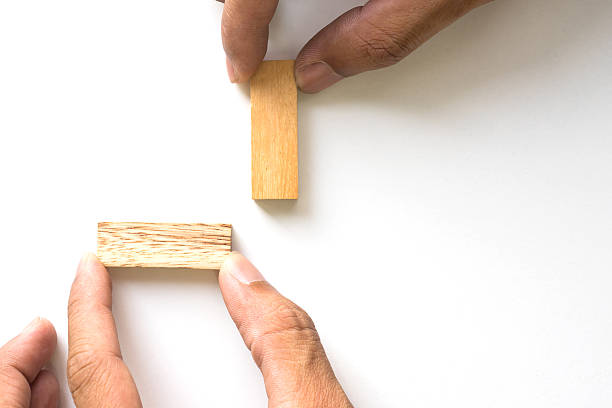 istock Hand arranging wood block. 507689500