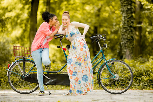 istock Young women posing by the bicycle 507690224