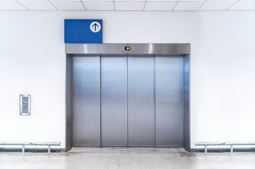 Large freight elevators in modern building. Can be office, school, hospital, Shopping plaza, mega store or factory