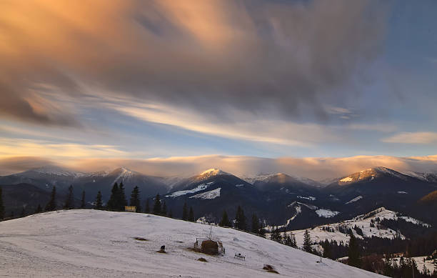 istock landscape with sunrise light and moving clouds 507691202