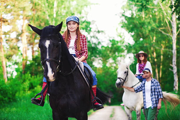 istock family and horse 507691946