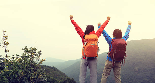 istock two successful backpacker enjoy the beautiful landscape at mountain peak 507692410