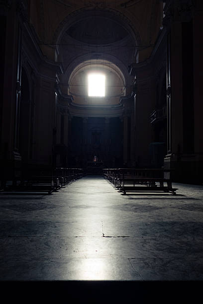 istock Light across Window in a Church 507692834