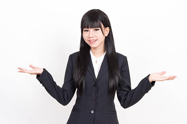 istock asian business woman showing something with open hands 507705920