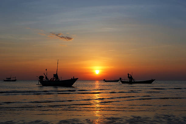 istock Fishing boat at sunset 507706008