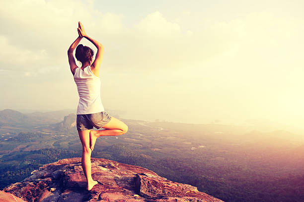 istock yoga woman mountain peak 507707672