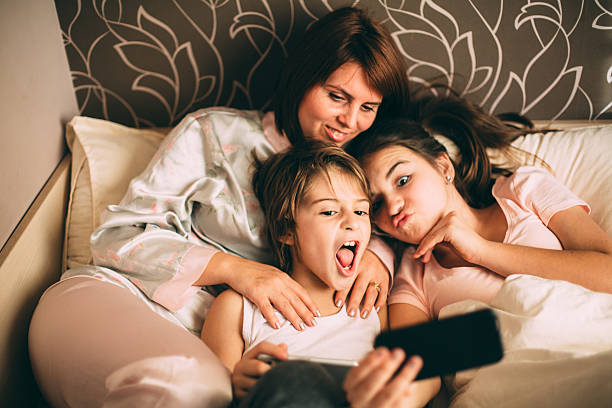 istock Mother and children taking a selfie 507710222