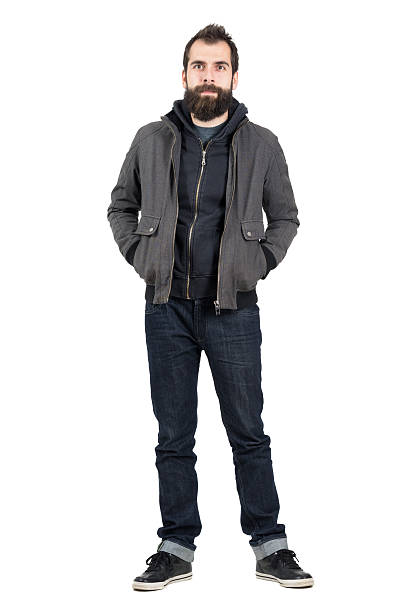 istock Smiling hipster with hands in pockets looking at camera 507710312