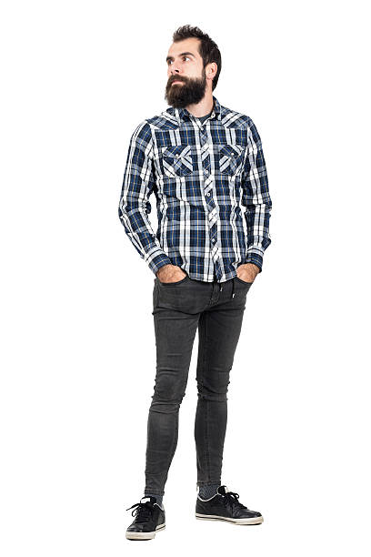 istock Serious bearded hipster in plaid shirt looking away 507711062