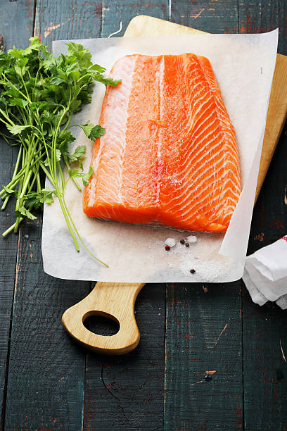 istock fresh salmon steak on white paper 507711374