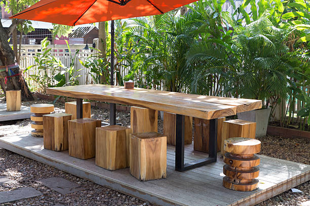 istock wooden table and stool in the garden 507711678