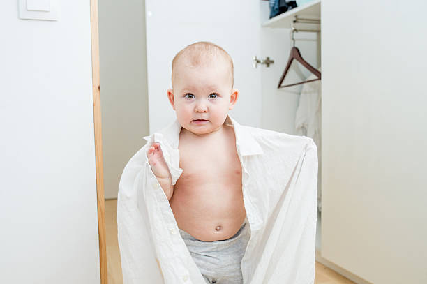 istock little child trying on clothes 507713834