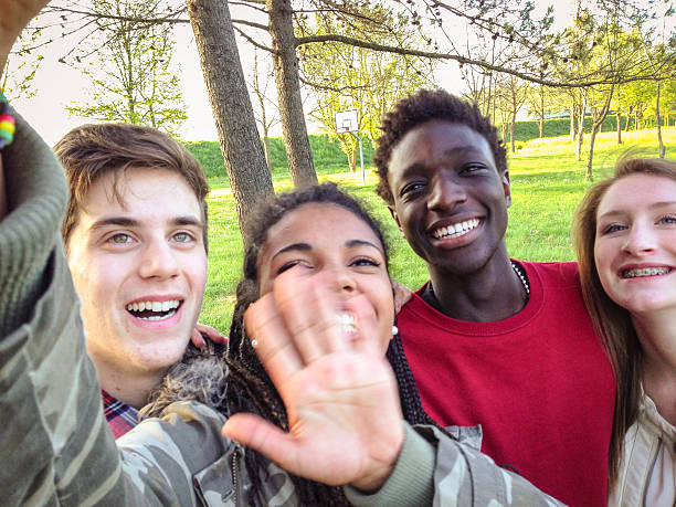 istock Group of college student laughing and doing a selfie 507715008