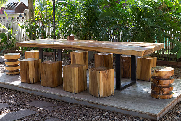 istock wooden table and stool in the garden 507715472