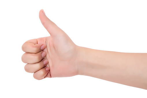 woman hand showing thumbs up sign isolated on white