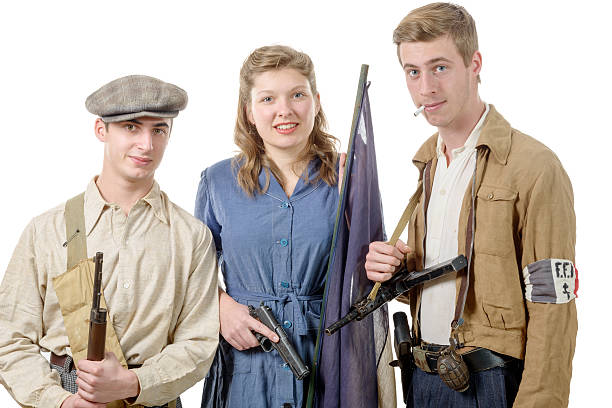 istock three young French Resistance, vintage clothes and weapons, reen 507716952