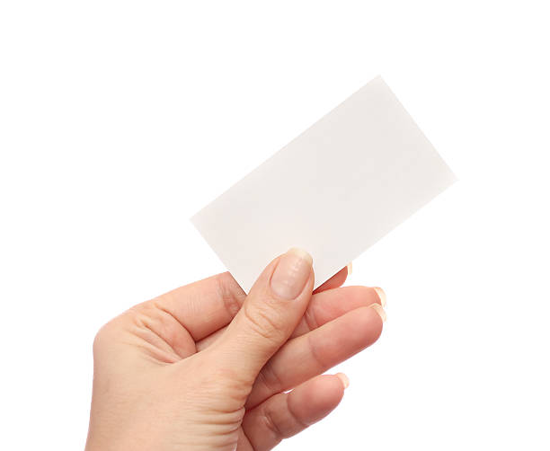 istock Female hand holds business card on white background 507717770