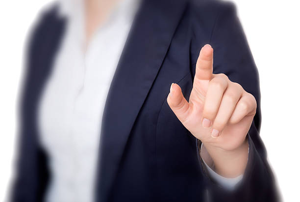 istock Young business woman pointing at something over white background 507720034
