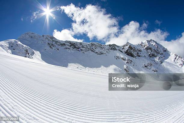 Perfectly Groomed Empty Ski Piste Stock Photo - Download Image Now - Blue, Cold Temperature, Day