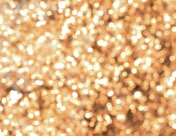 istock Abstract golden lights bokeh background 507720620