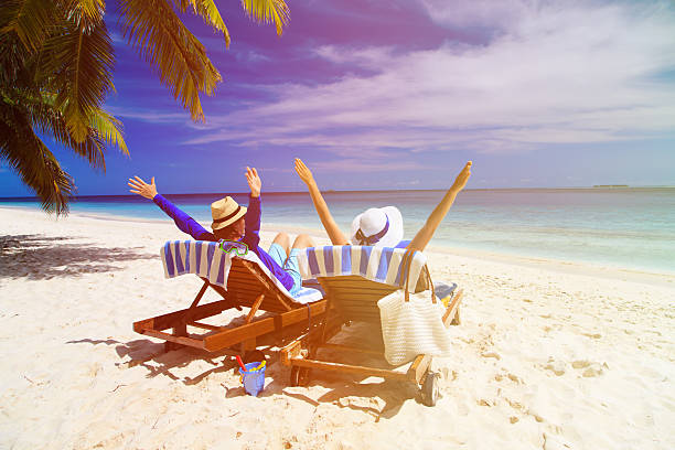istock happy couple relax on a tropical beach 507720684