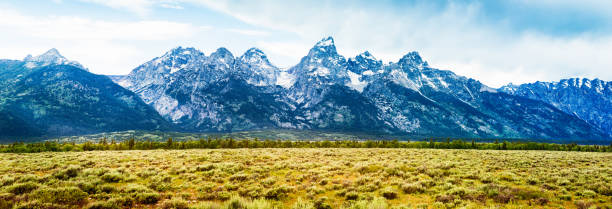 istock Teton Range Rocky Mountains Wyoming with prairie Panorama 507723939