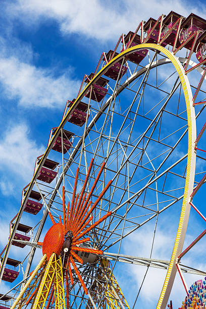 istock Ferris wheel against a blue sky on a sunny day 507725779