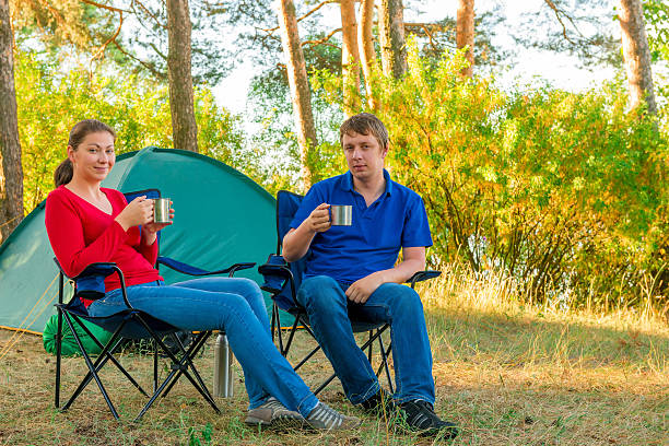 istock spouses drinking tea in the morning in a camp 507727773