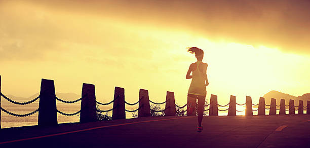 istock Runner athlete running at seaside road.vintage effect 507743306