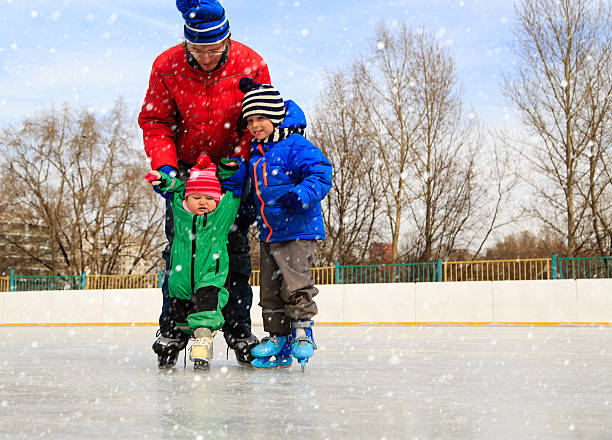 istock father with two kids skating in winter 507743532